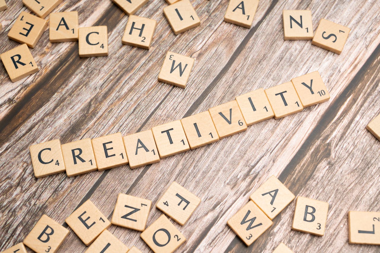 Crafting Captivating Headlines: Your awesome post title goes here Wooden letter tiles spelling 'creativity' on a rustic wooden background.
